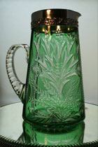 silver adorned pitcher